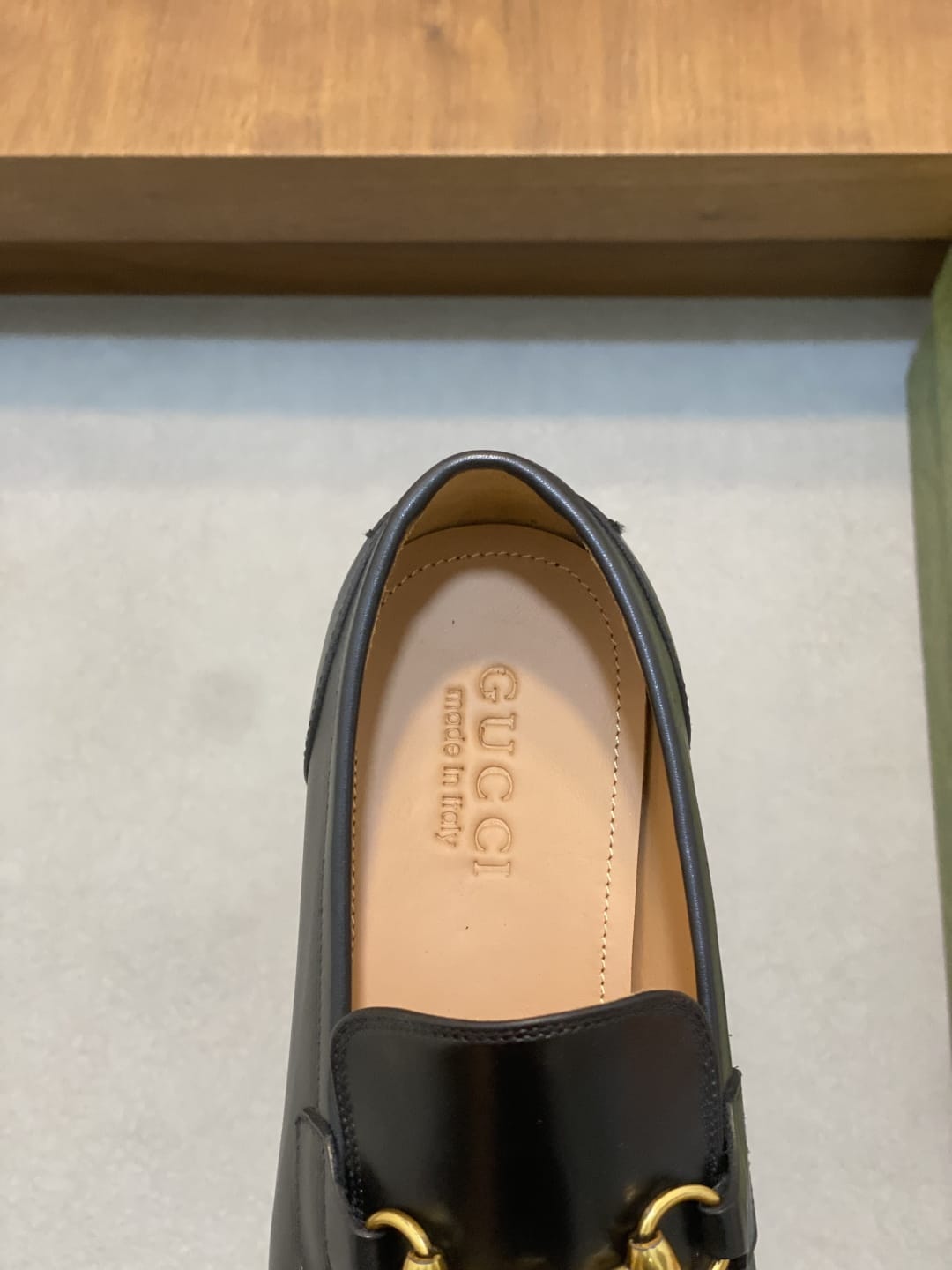 GUCCI Black leather loafer is designed with an elongated for MEN