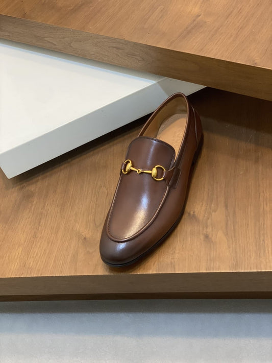 GUCCI Brown leather loafer is designed with an elongated for MEN