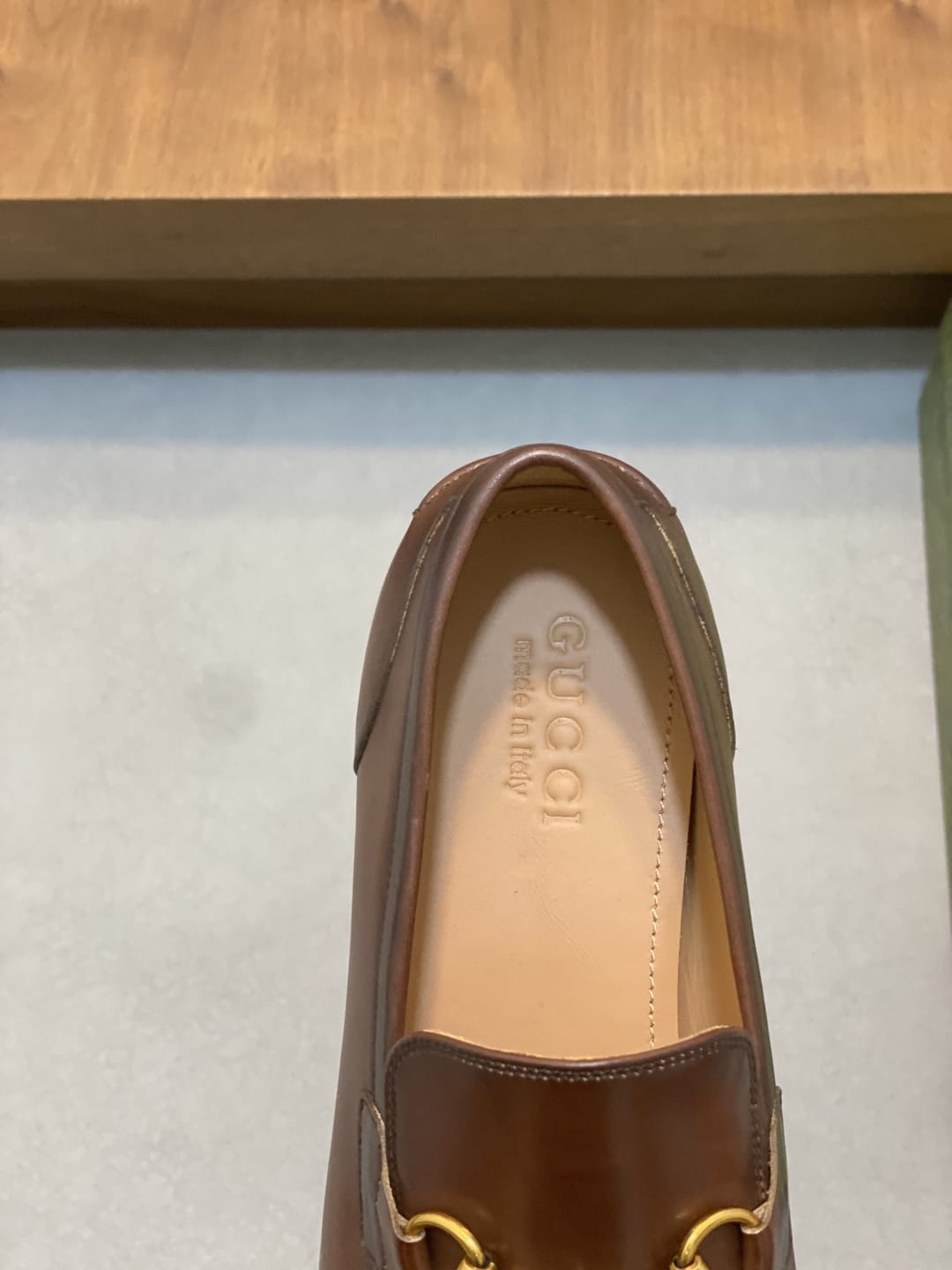 GUCCI Brown leather loafer is designed with an elongated for MEN
