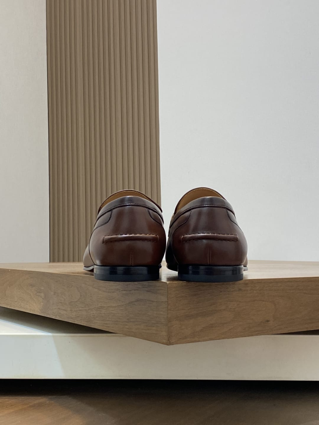 GUCCI Brown leather loafer is designed with an elongated for MEN