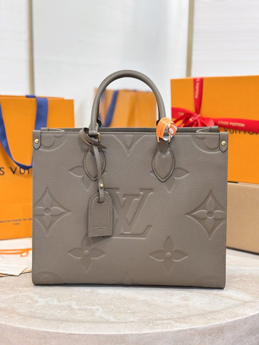Louis Vuitton OnTheGo MM Monogram Empreinte leather Hand Bags for women