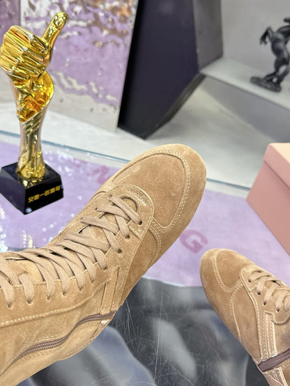 Miu Miu  Gymnasium suede and shearling boxer boots for women